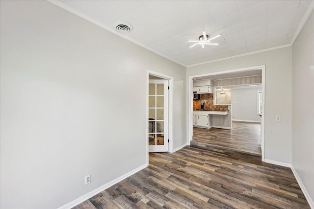 5520 N Circuit Dr, Beaumont, TX 77706 - unfurnished room with baseboards, crown molding, dark wood-type flooring, and visible vents