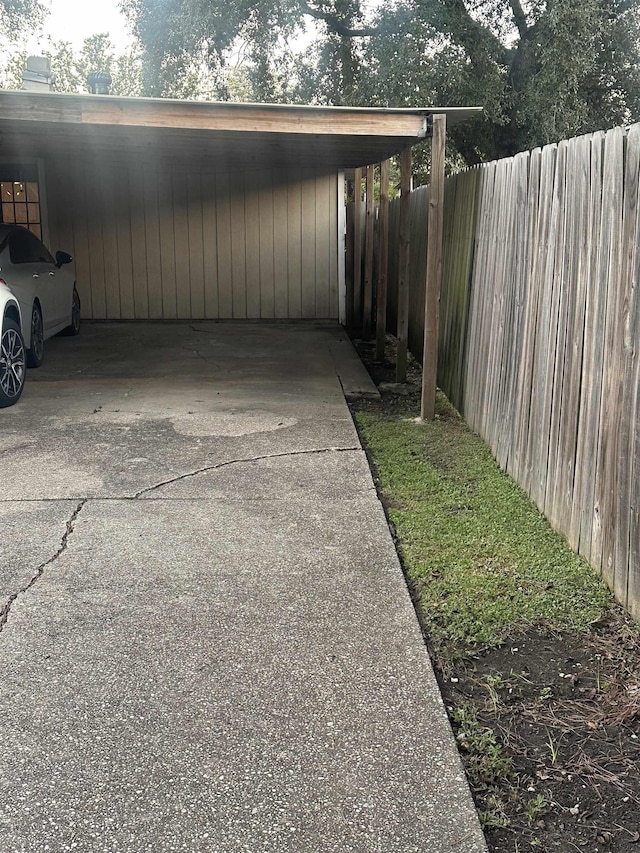 exterior space with a carport