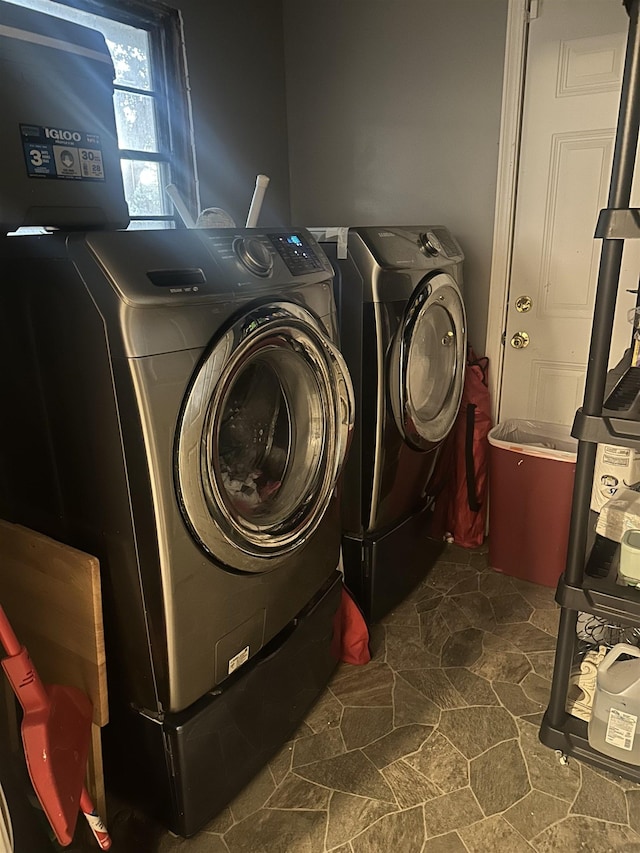 laundry area with independent washer and dryer