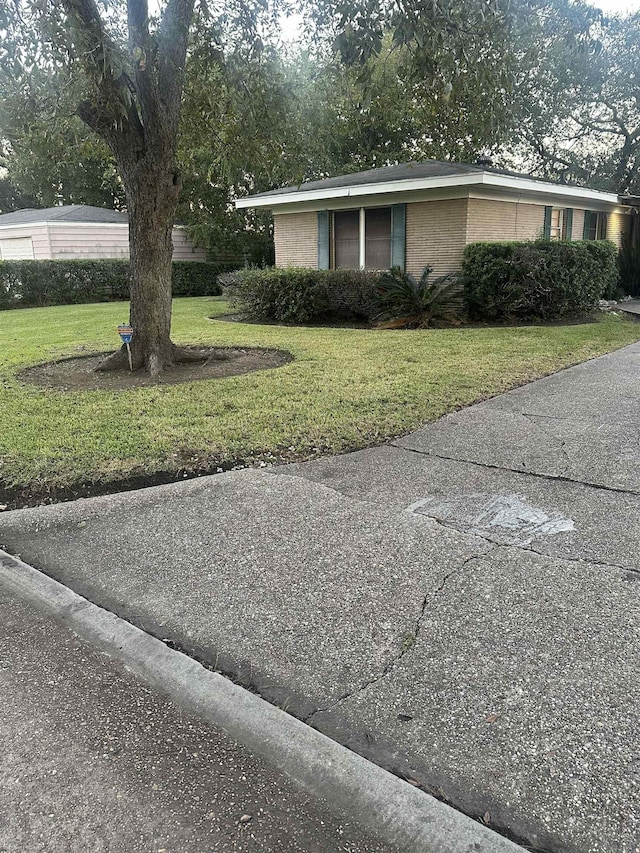 view of home's exterior featuring a yard