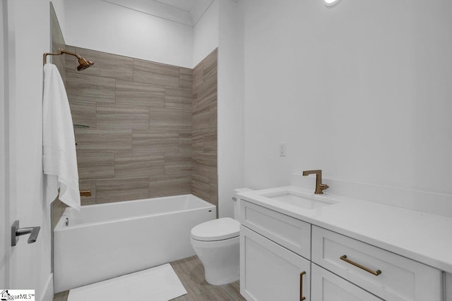 full bathroom with vanity, toilet, and tiled shower / bath