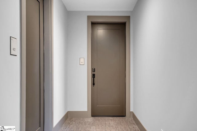 doorway to outside with elevator