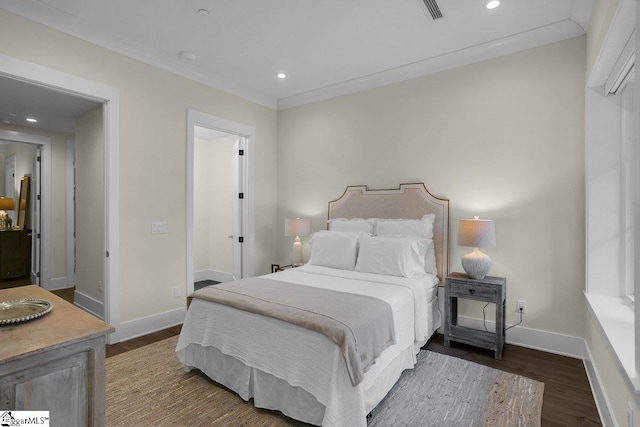 bedroom featuring dark hardwood / wood-style flooring