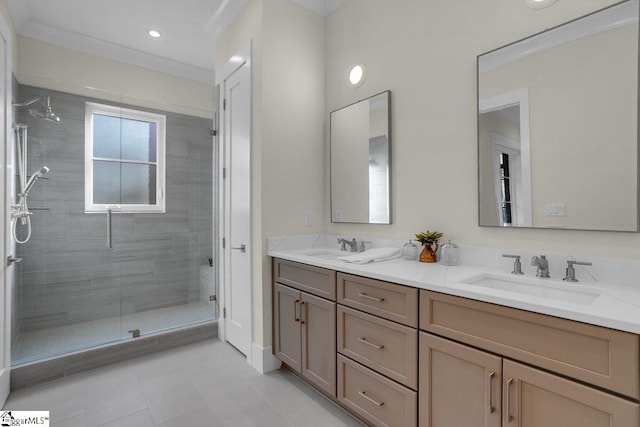 bathroom with crown molding, vanity, and walk in shower