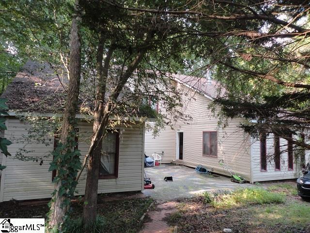 view of side of property with a patio