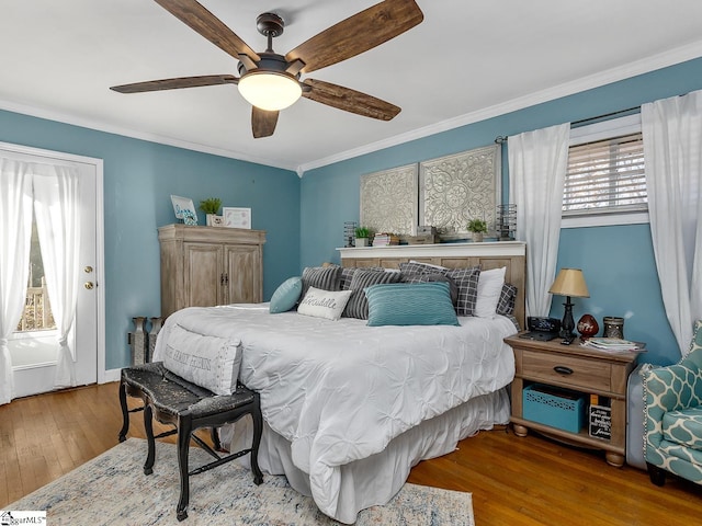 201 White Oak Rd, Woodruff, SC 29388 - bedroom with ornamental molding, ceiling fan, and wood-type flooring