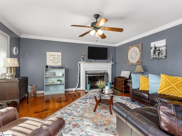 201 White Oak Rd, Woodruff, SC 29388 - living room with crown molding, ceiling fan, dark hardwood / wood-style flooring, and a brick fireplace