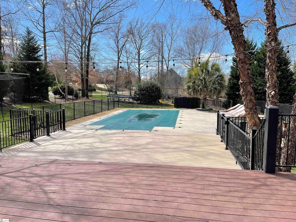 view of swimming pool featuring a deck