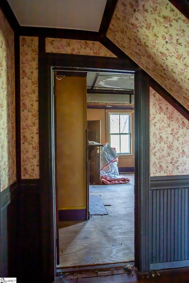 corridor featuring vaulted ceiling