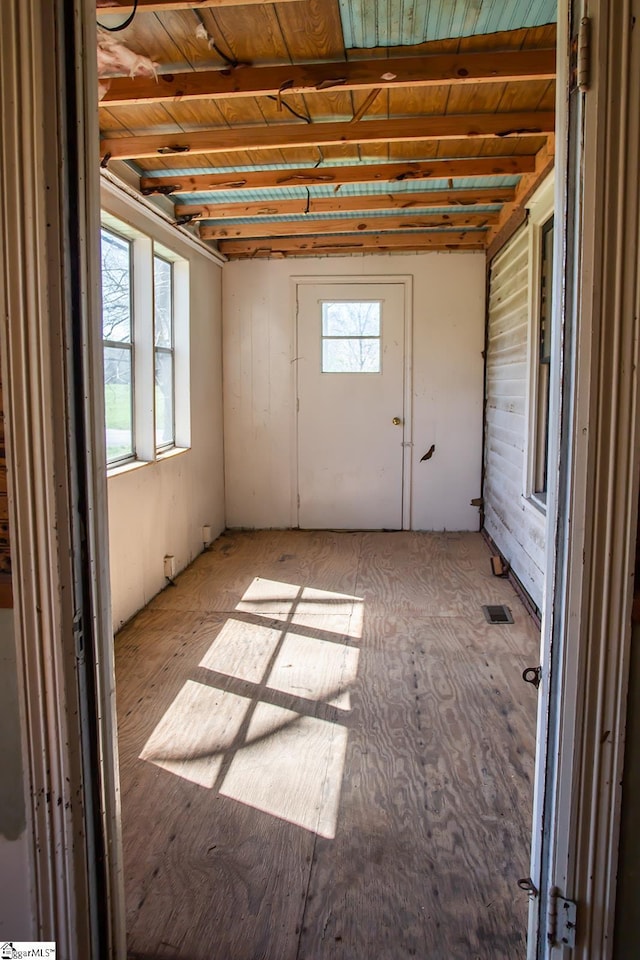 basement with light hardwood / wood-style flooring