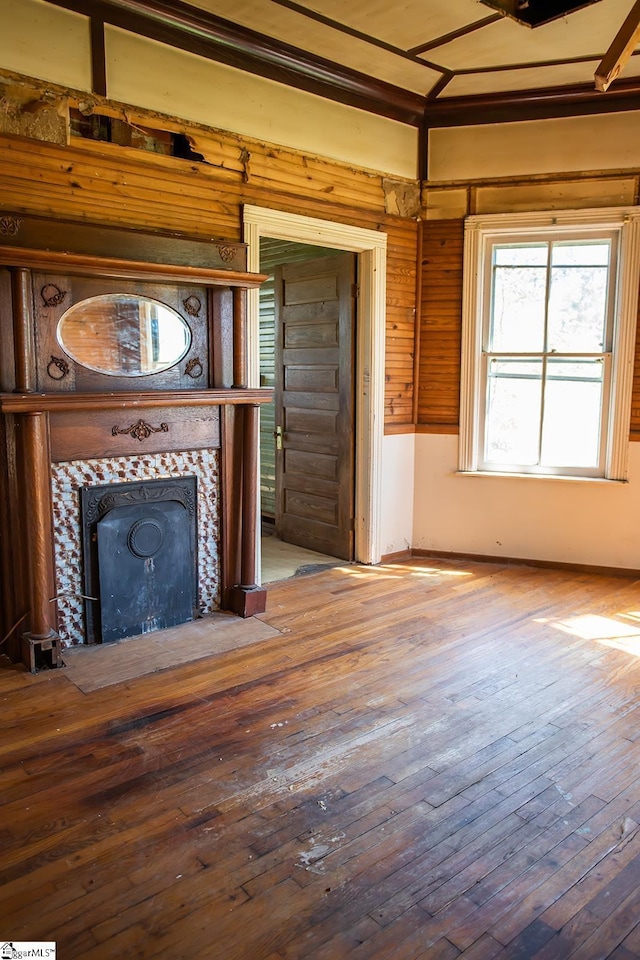 unfurnished living room featuring hardwood / wood-style floors and a fireplace