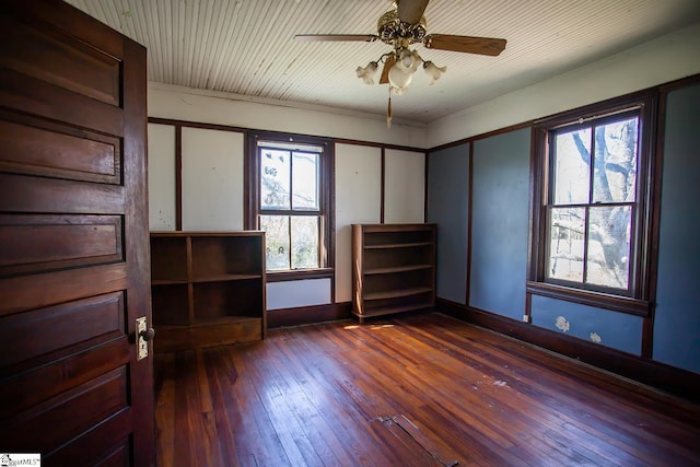 spare room featuring ceiling fan, ornamental molding, and dark hardwood / wood-style floors