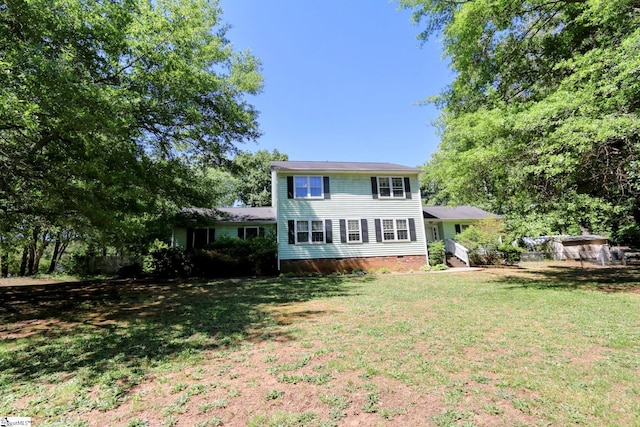 rear view of property with a yard