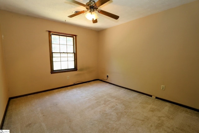 carpeted empty room with ceiling fan