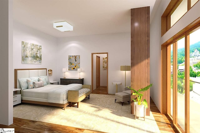 bedroom featuring light hardwood / wood-style flooring and access to exterior