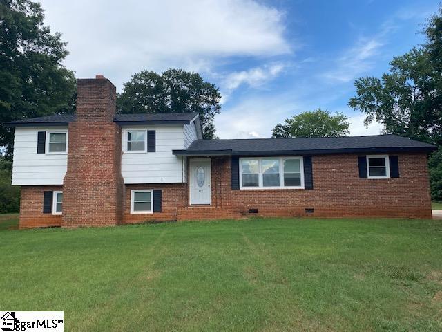 split level home with a front yard