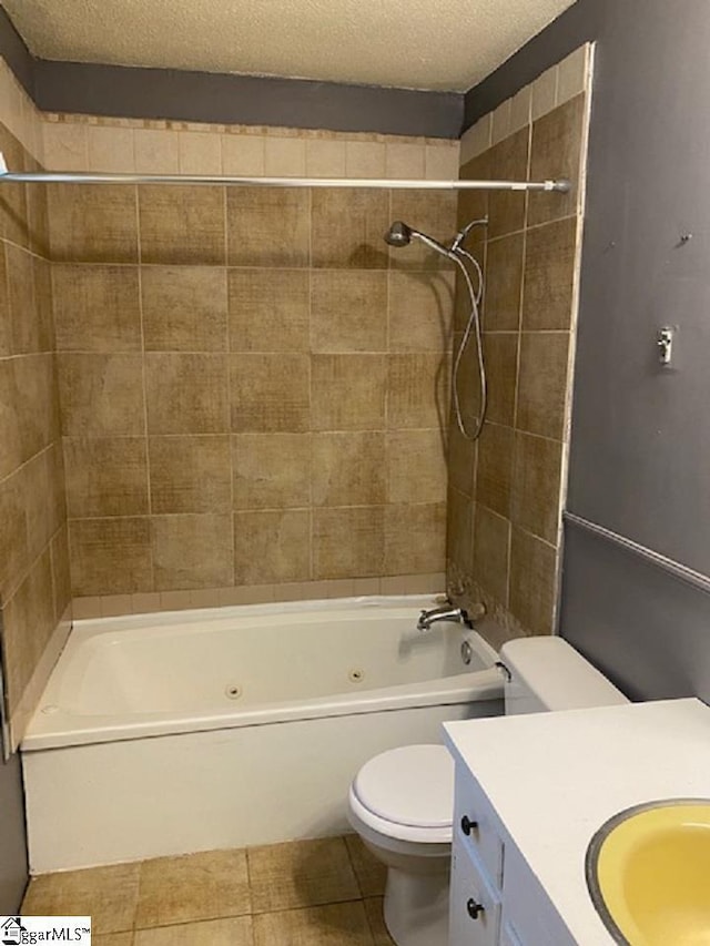 full bathroom with tile flooring, tiled shower / bath combo, a textured ceiling, toilet, and vanity