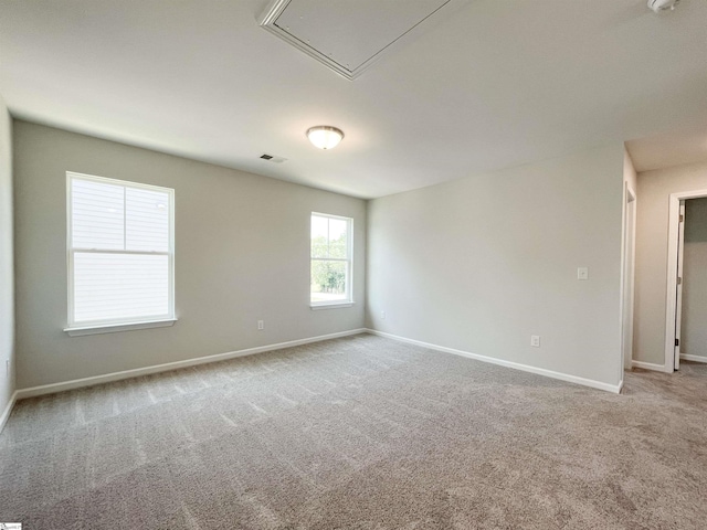 unfurnished room with light carpet