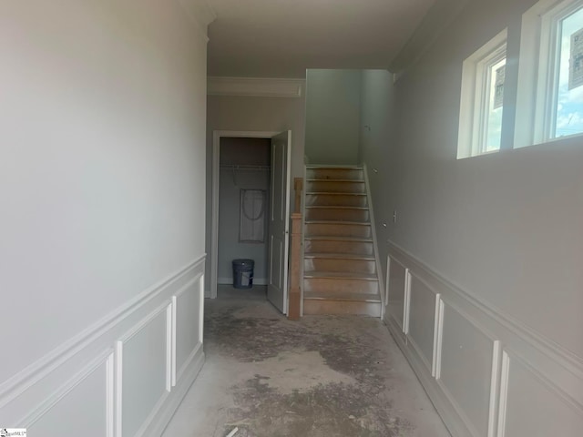 staircase featuring crown molding