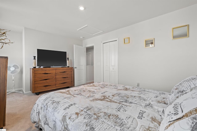 bedroom featuring a closet and light colored carpet