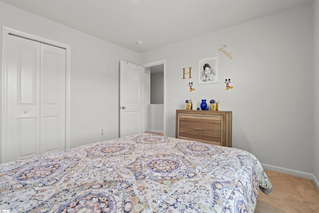 carpeted bedroom featuring a closet