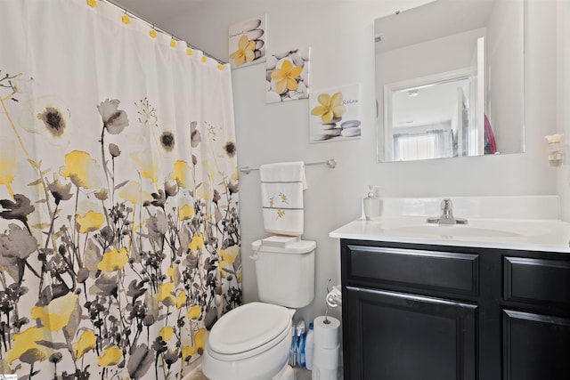 bathroom with toilet and vanity