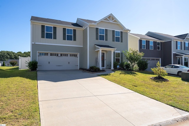 view of front of property featuring a front yard and a garage