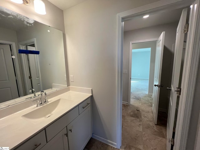 bathroom featuring tile floors and vanity