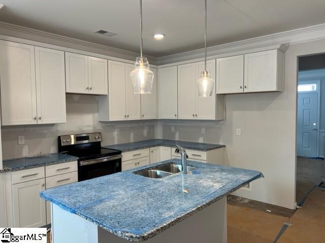 kitchen featuring white cabinets, hanging light fixtures, a center island with sink, electric range, and sink