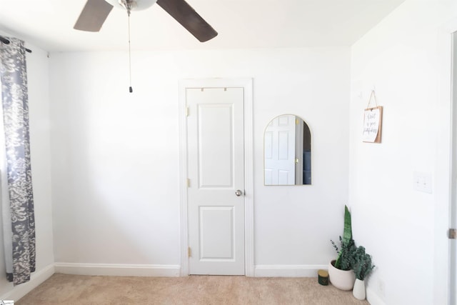 interior space featuring ceiling fan