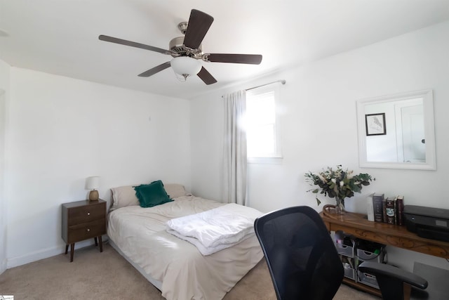 bedroom featuring light colored carpet and ceiling fan