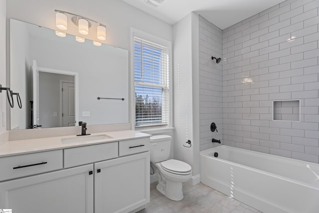 full bathroom featuring visible vents, toilet, vanity, and shower / tub combination