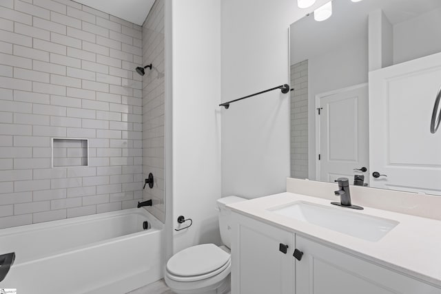 bathroom featuring toilet, bathtub / shower combination, and vanity