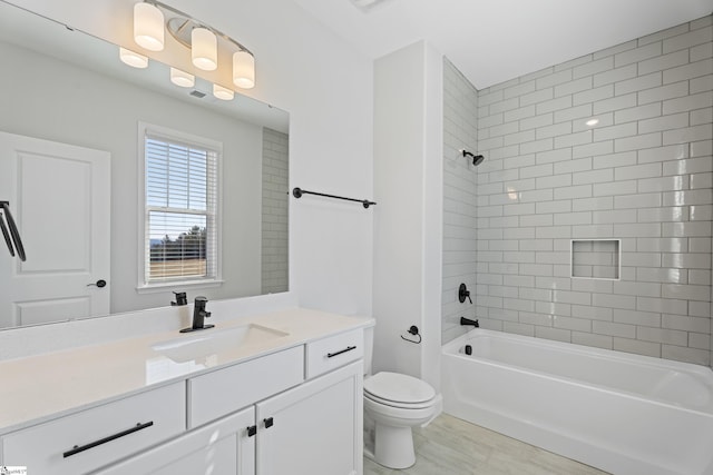 full bathroom with toilet, vanity, and shower / tub combination