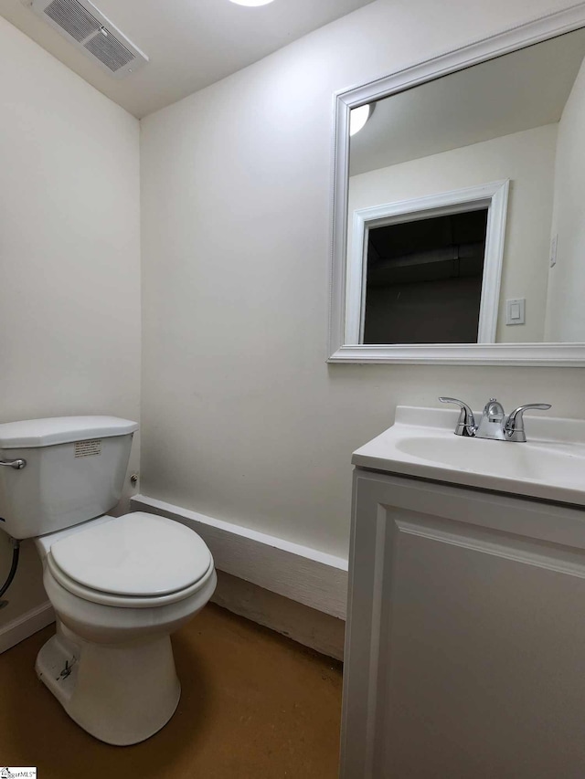 bathroom with toilet and vanity