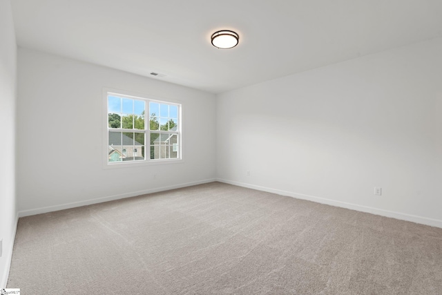 unfurnished room with carpet floors