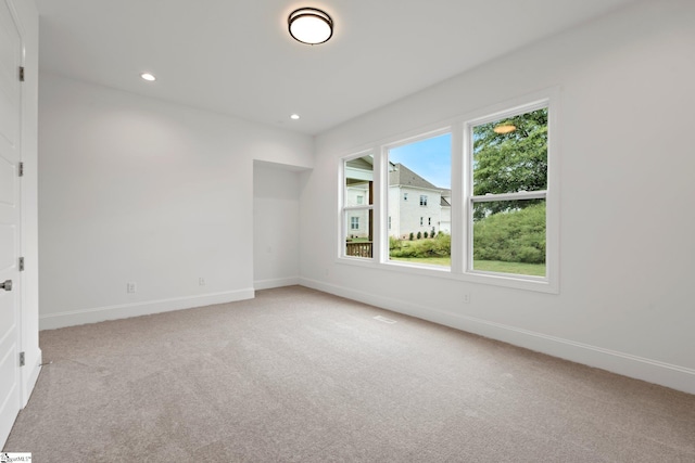 unfurnished room featuring carpet flooring