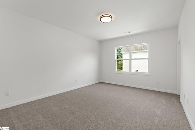 unfurnished room featuring carpet floors