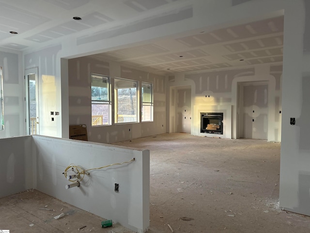 unfurnished living room featuring a fireplace