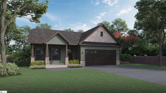 craftsman-style house featuring a front yard and a garage