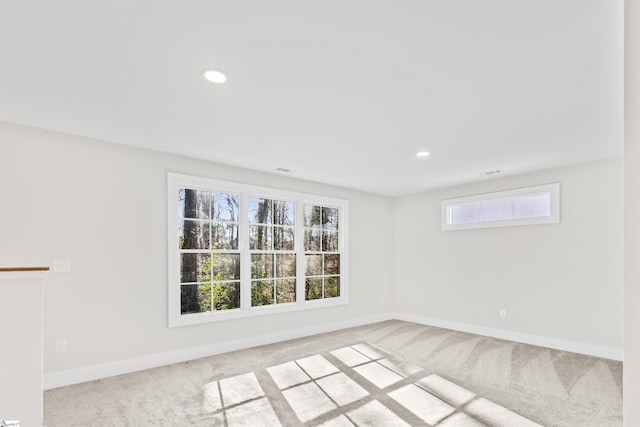 empty room with light colored carpet