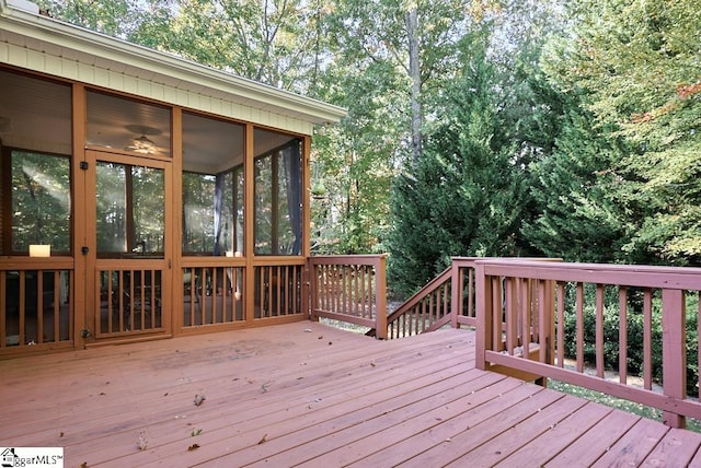 wooden terrace with a sunroom