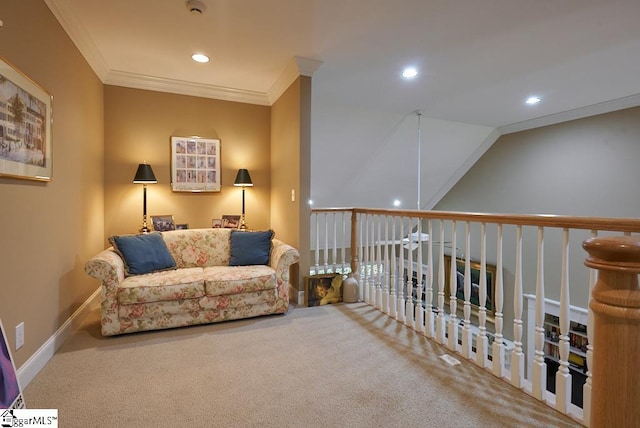 sitting room with carpet floors and ornamental molding