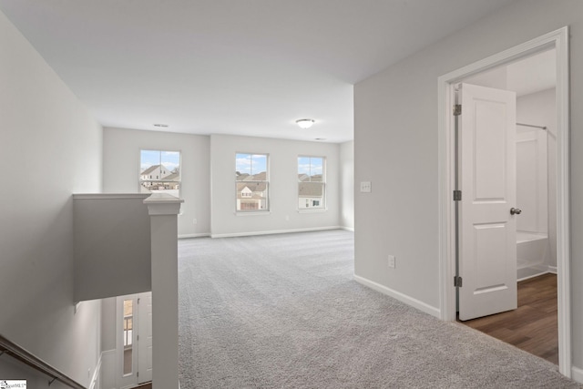 hallway with carpet