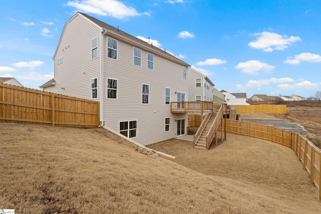 rear view of house featuring a deck