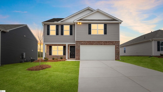 view of front of home featuring central AC, a garage, and a lawn