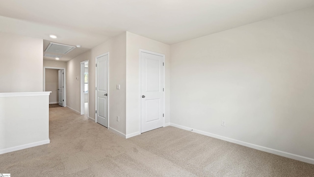 empty room with light colored carpet