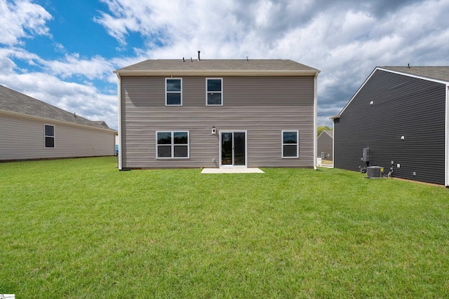 back of house with a yard, a patio, and central air condition unit