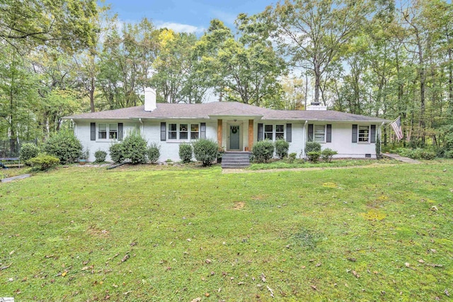 ranch-style home with a front lawn