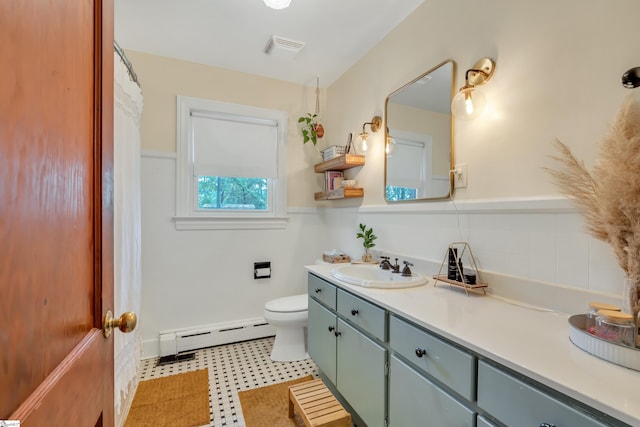 bathroom featuring vanity, a baseboard radiator, and toilet